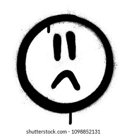 graffiti sprayed sad face icon in black over white