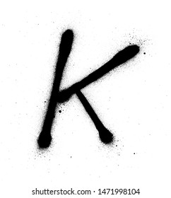 graffiti thin K font sprayed in black over white