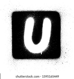 graffiti U font sprayed in white over black square