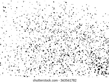 Grainy grunge abstract texture on a white background. Vector splatter of calligraphy ink in black on white background. Black ink blow explosion on white background. Paint spray, drop. Vector.