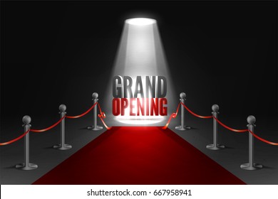 Grand opening event in spotlights. Red carpet between two barriers. Red ribbon cut ceremony.