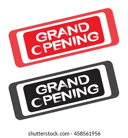Grand opening label - white text on a red or black background. Two graphic element