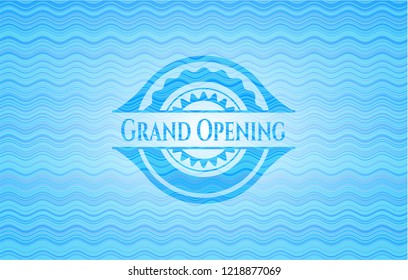 Grand Opening light blue water wave emblem.