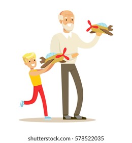 Grandfather And Boy Playing Toy Planes, Part Of Grandparents Having Fun With Grandchildren Series