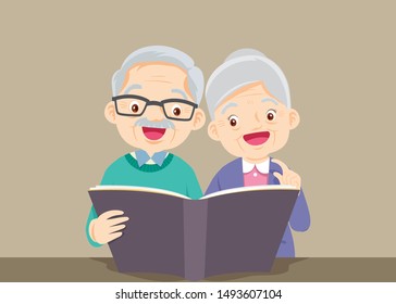 grandfather with grandmother reading book together,Happy elder is looking at wife which is reading book in bright room