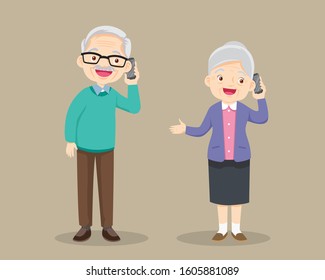 grandfather and grandmother talking on the cell phone.grandparent Speaking On The mobile phone.