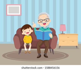 Grandfather sitting with grandchildren on sofa with the book