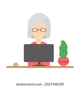 Grandma works at the computer, freelancing, remoting, old people and technology. An elderly woman works at a computer. Pensioners and technology.