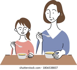 grandmother and grandchild having a meal