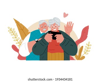 Grandmother is holding a cell phone, Grandfather is waving his hand. Joyful pensioners with mobile gadgets. Video calls through the phone.