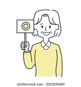 Grandmother holding a circled tag