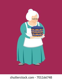 Grandmother with pie. grandma and blueberry cake. Elderly woman

