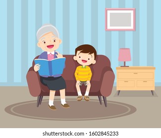grandmother  sitting with grandchildren on sofa with the book