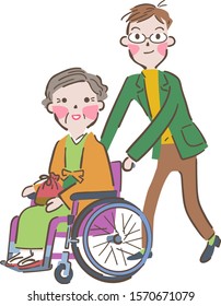 Grandmother sitting in a wheelchair wearing a kimono and son pushing the wheelchair