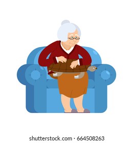 Grandmother And Turtle Pet Sitting On Chair. Grandma And Tortoise. Old Woman And Animal Amphibian. Gammer And Beast
