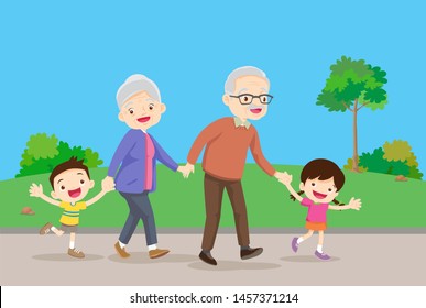 Grandparents and grandchildren. Happy grandparents with their grandchildren taking a walk in garden.grandparents with kids are walkers in the park.