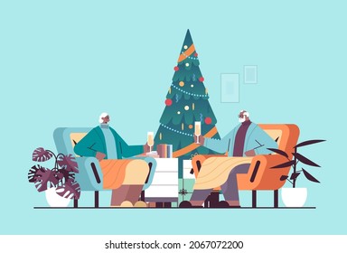 grandparents in santa hats drinking champagne senior people celebrating new year christmas holidays