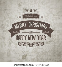 Grange retro old-looking Christmas card on aged stained paper with classic victorian floral element as background with merry christmas and happy new year greeting in the middle. Monochrome badge