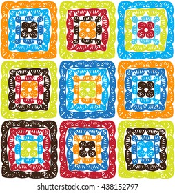 Granny squares pattern and Ripples Afghan. Crochet blanket of square elements, handmade, multicolored knitted squares, cozy blanket.