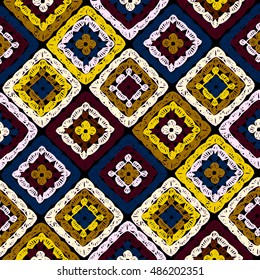 Granny squares pattern and Ripples Afghan. Crochet blanket of square elements, handmade, multicolored knitted squares, cozy blanket.