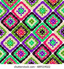 Granny squares pattern and Ripples Afghan. Crochet blanket of square elements, handmade, multicolored knitted squares, cozy blanket.