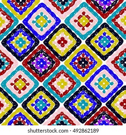 Granny squares pattern and Ripples Afghan. Crochet blanket of square elements, handmade, multicolored knitted squares, cozy blanket.