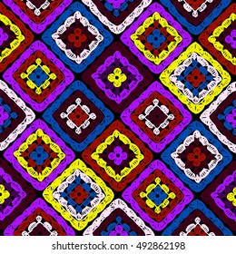 Granny squares pattern and Ripples Afghan. Crochet blanket of square elements, handmade, multicolored knitted squares, cozy blanket.