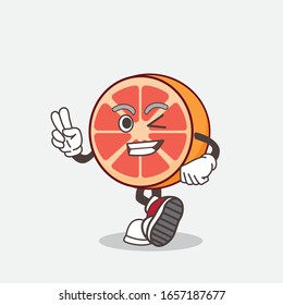 Grapefruit cartoon mascot character with two fingers
