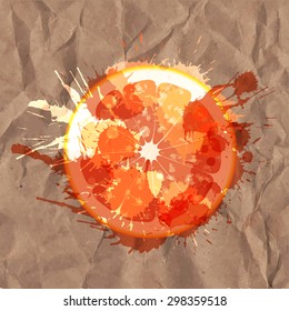 Grapefruit slice made of colorful splashes on a crumpled paper background
