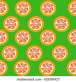 Grapefruit  slices seamless on green background