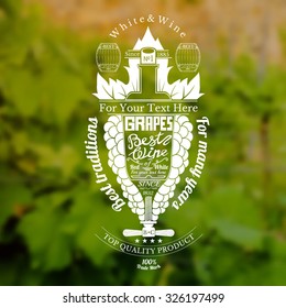 Grapes bunch with bottle for text in the center wine label on blurred grapes bush background