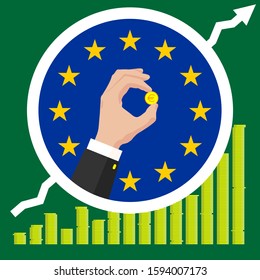 The graph of the European Union economic growth in the form of piles of gold coins, against the background of the flag and the hands of a business man in a suit with a golden euro coin. 