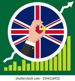 The graph of the Great Britain economic growth in the form of piles of gold coins, against the background of the flag and the hands of a business man in a suit with a golden pound sterling coin.
