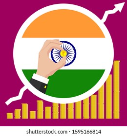 The Graph Of The India Economic Growth In The Form Of Piles Of Gold Coins, Against The Background Of The National Flag And The Hands Of A Business Man In A Suit With A Golden Indian Rupee Coin.