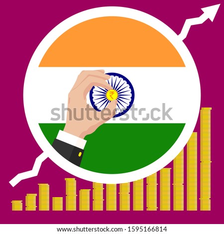 The graph of the India economic growth in the form of piles of gold coins, against the background of the national flag and the hands of a business man in a suit with a golden indian rupee coin.
