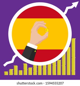 The graph of the Spain economic growth in the form of piles of gold coins, against the background of the national flag and the hands of a business man in a suit with a golden euro coin.