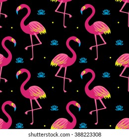 Graphic beautiful seamless pattern with exotic bird, pink flamingos, water lilies, lotus, colored wings and points in vector on black background. Tropical illustration of nature wildlife animal planet