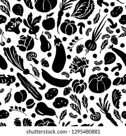 Graphic black white vegetable pattern.Silhouettes of vegetables and fruits. Tasty food. Seamless ornament for decorating various surfaces.
