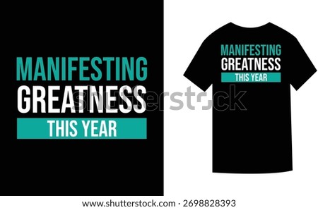 A graphic design featuring the text "MANIFESTING GREATNESS THIS YEAR" in teal and white, presented on a black t-shirt mockup.