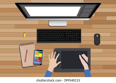 graphic design workspace with digital sketching and monitor