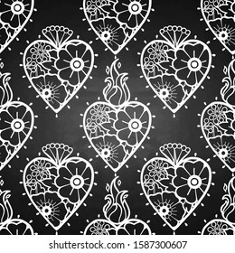 Graphic flaming hearts with floral decorations. Inspired by old school tattoo style. Vector seamless pattern