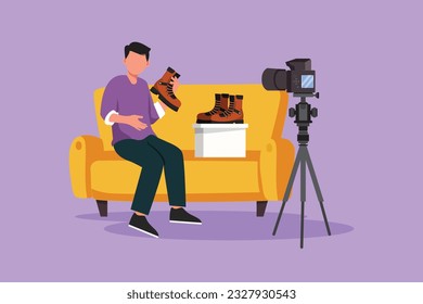 Graphic flat design drawing social media influencer reviewing boots. Smiling young man vlogging about men's sports shoe and filming himself at home on a video camera. Cartoon style vector illustration