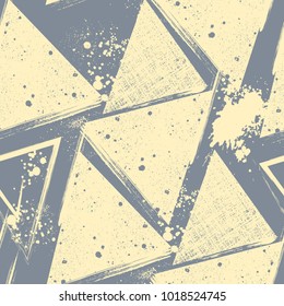 Graphic grunge seamless pattern with textured triangles