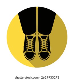 Graphic illustration of black pants and black shoes featuring laces on a solid yellow circular background with shadow effects, ideal for minimalist backgrounds.