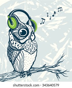 Graphic owl with green headphones listening music on a branch. Vector cartoon illustration.