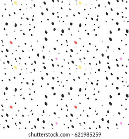 graphic pattern of colored spots painted