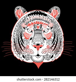 Graphic portrait of ornamental tiger on a black background