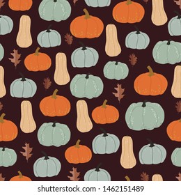 Graphic pumpkins and leaves seamless pattern. Vector backdrop. Dark background. Halloween. Autumn Wrapping paper design template.
