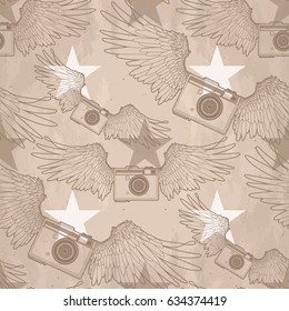 Graphic retro camera with two wings, stars and vintage background. Vector seamless pattern
