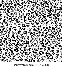Graphic seamless pattern with spots. Decorative black-and-white leopard skin.